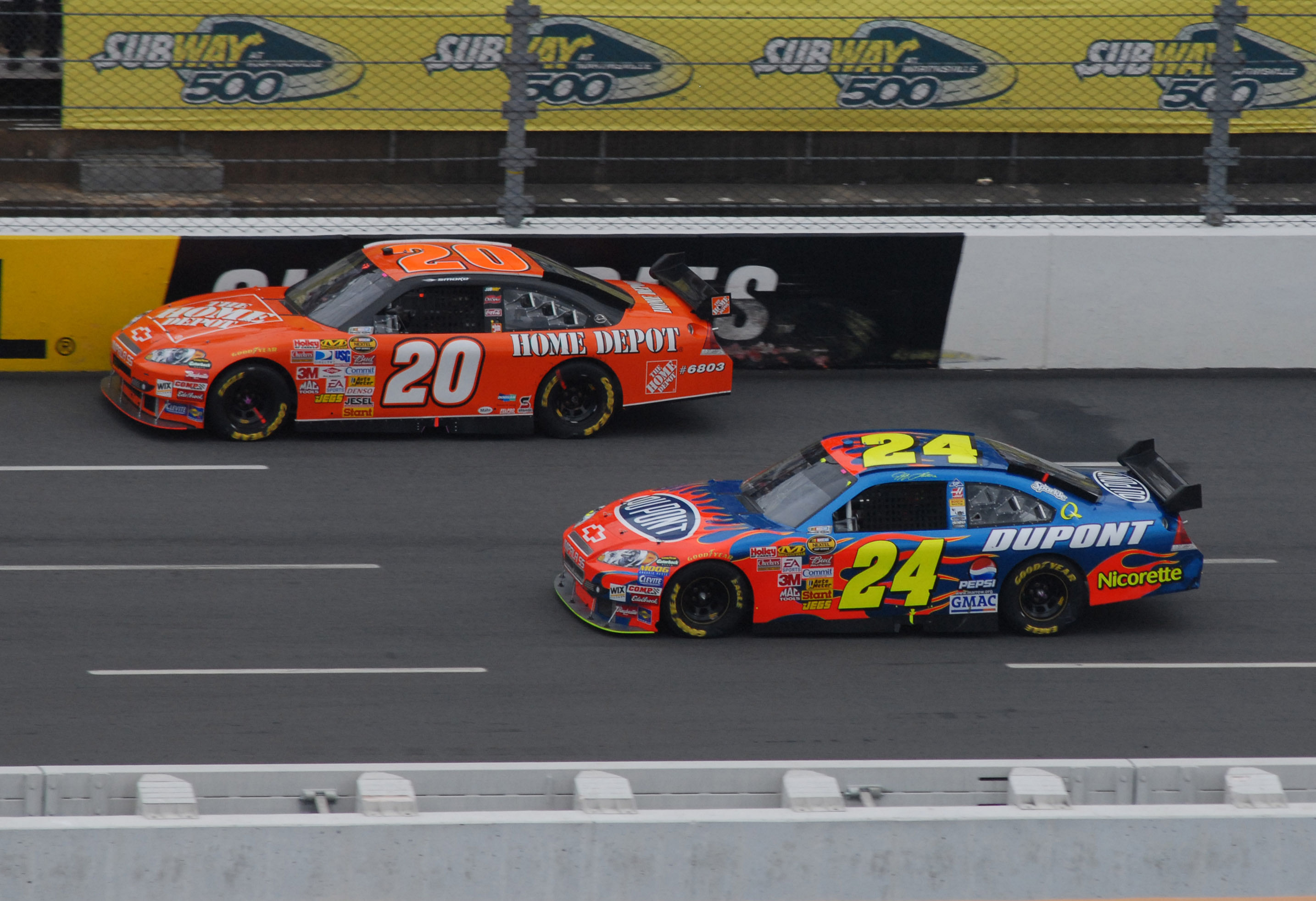 Tony Stewart (20) alongside Jeff Gordon (24) during the Goody's Cool Orange 500 at Martinsville Speedway in the Car of Tomorrow. Source: Imagn